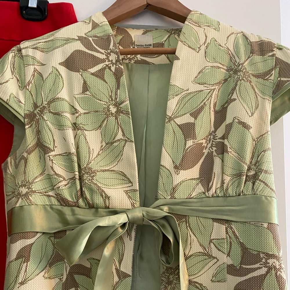 Elegant and soft light green and yellow vest with ribbon tie.